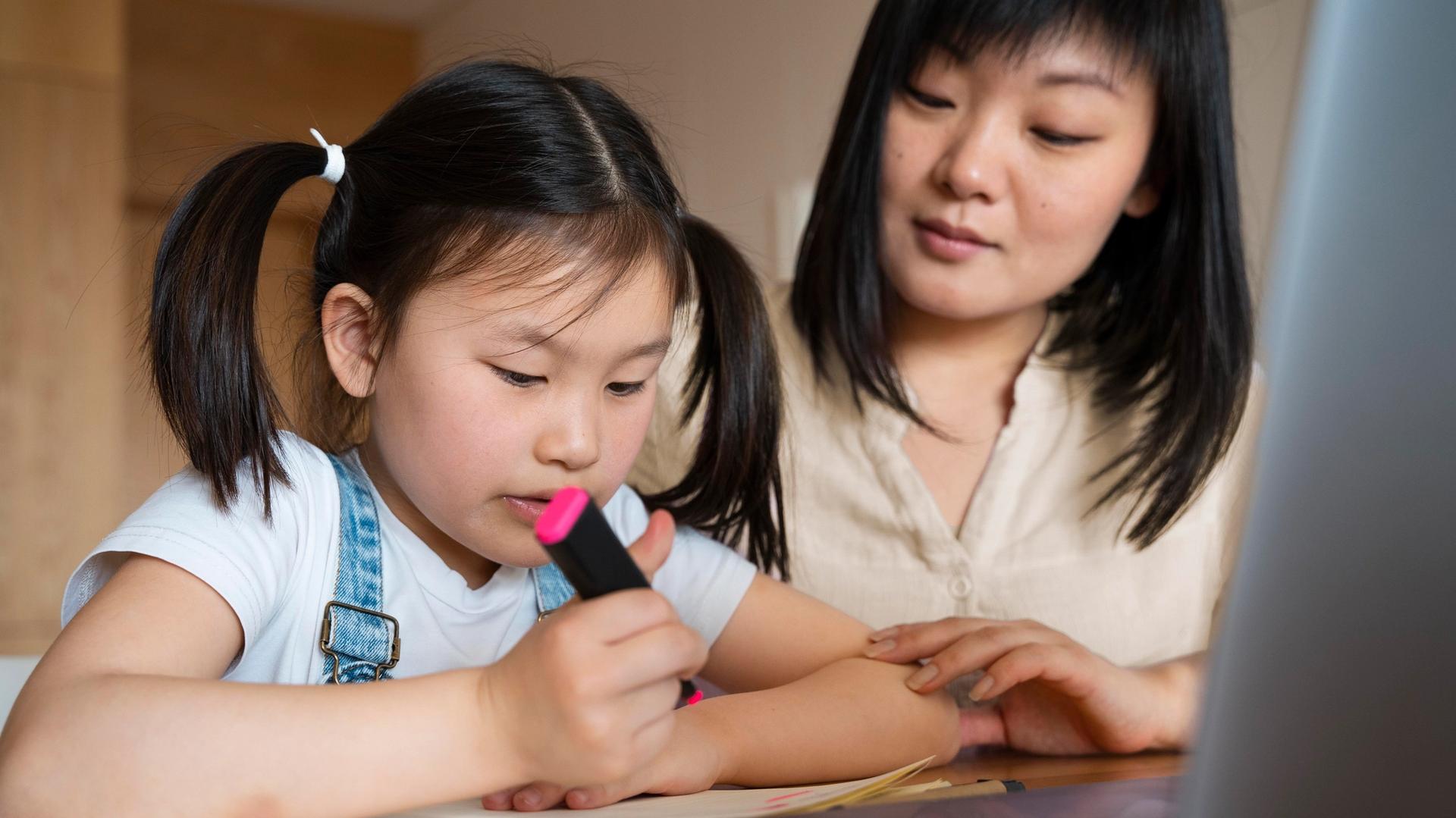 Parent comparing home tuition vs tuition centre options for a child in Singapore