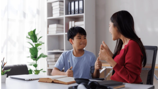 Tutor encouraging a student during a lesson, showing positive communication and trust in the learning process.