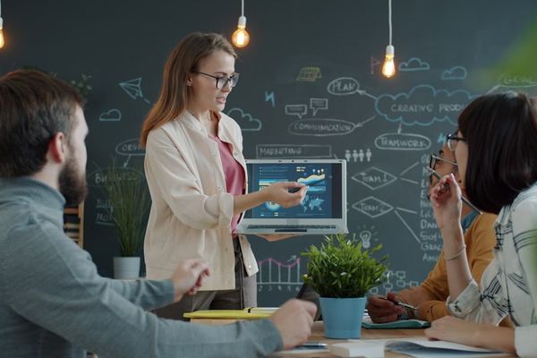 Woman presenting a business strategy to colleagues