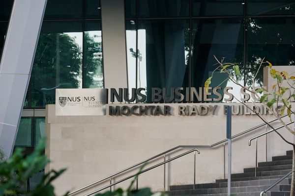 there is a sign that says in business on the side of a building