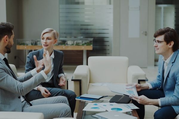 Three business people in a meeting