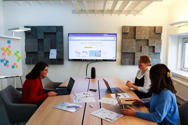 a group of people sitting around a conference table