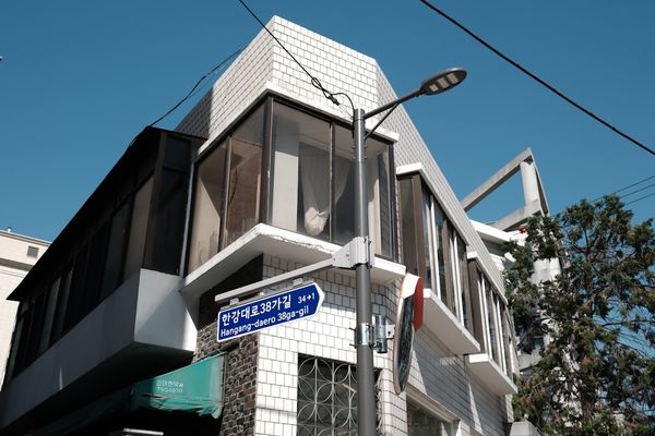 A modern building stands on a street corner.