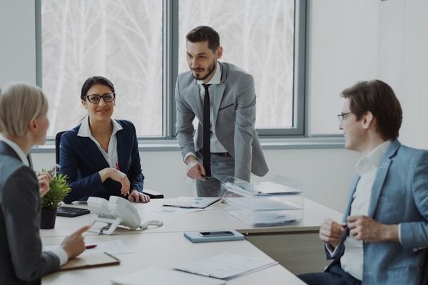 Business professionals collaborating around a conference table.