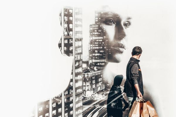 man carrying shopping bag