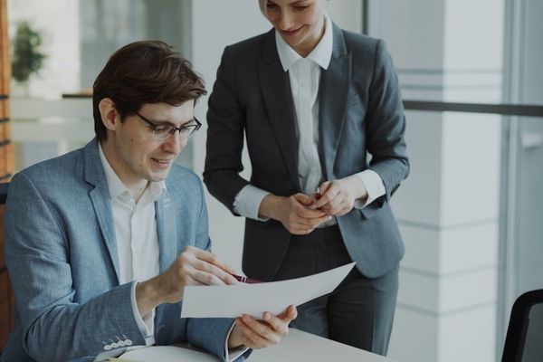 Two business people reviewing documents together