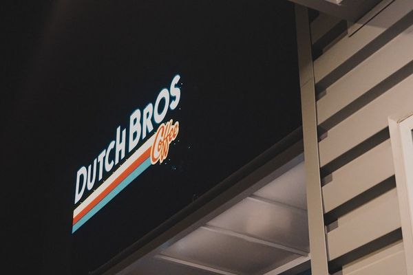 black and white UNKs neon sign