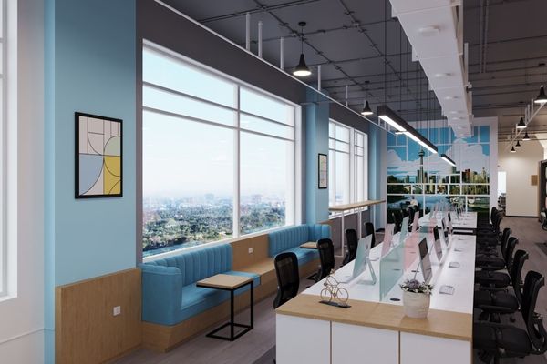a room with a long table and a blue couch
