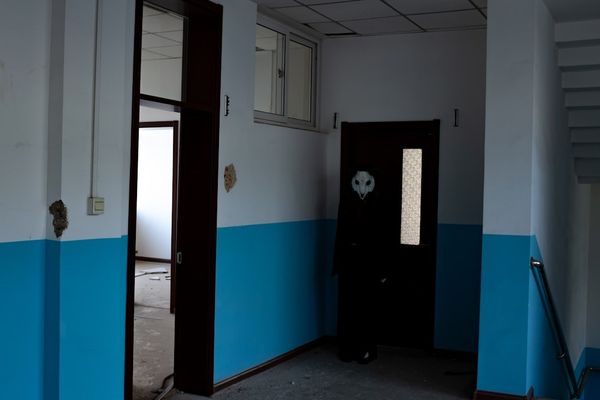 an empty room with blue and white walls