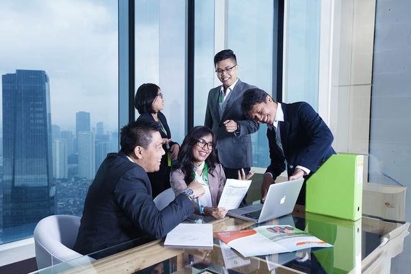 A group of business people sitting around a table