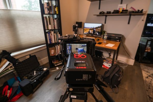 black and gray treadmill on white table