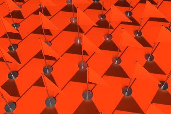 a large group of orange squares and poles
