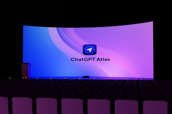 A large screen displays "chatgpt atlas" logo.