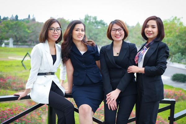 a group of women posing for a photo