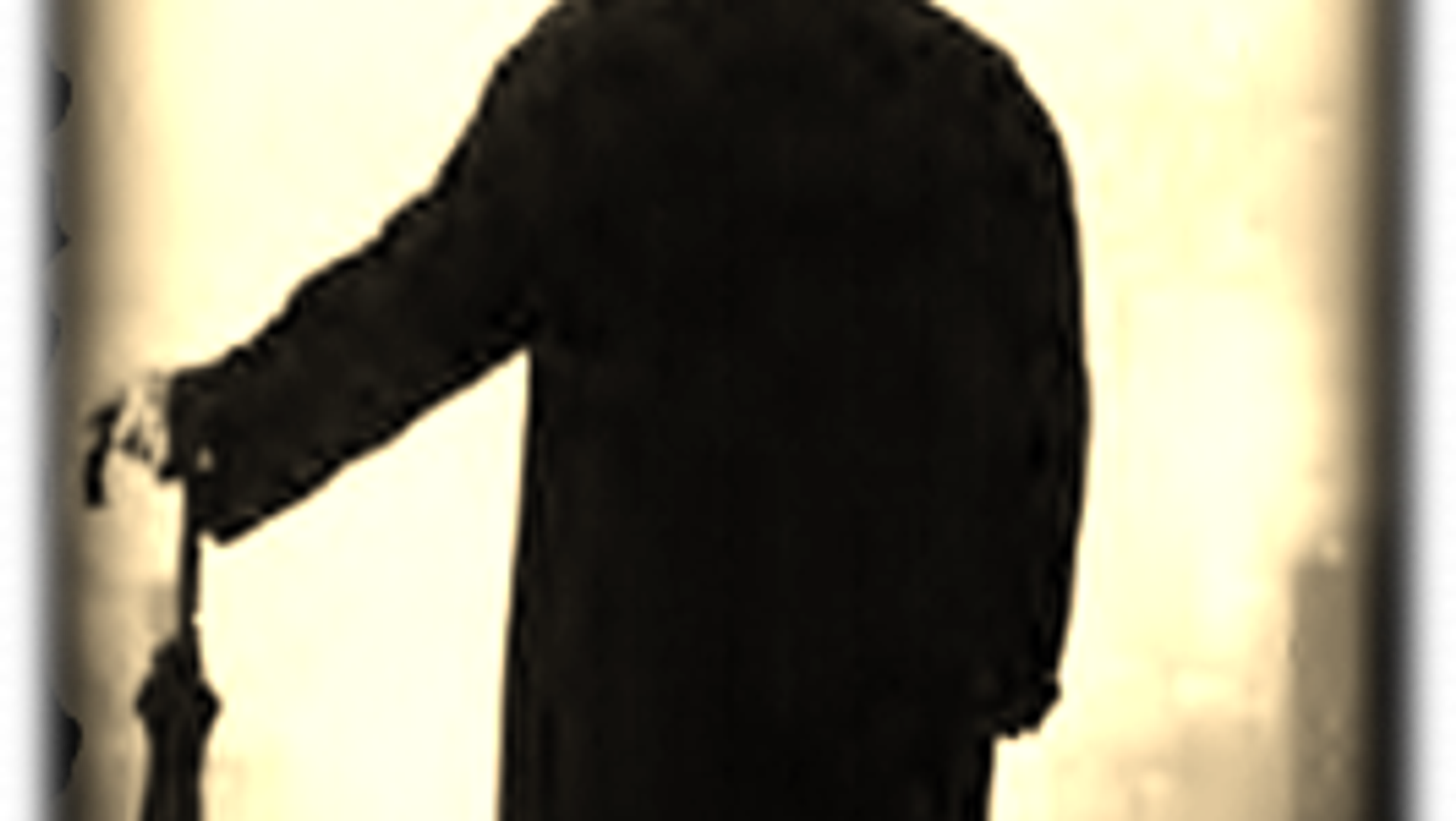 Atmospheric silhouette of Victorian figure with umbrella in fog