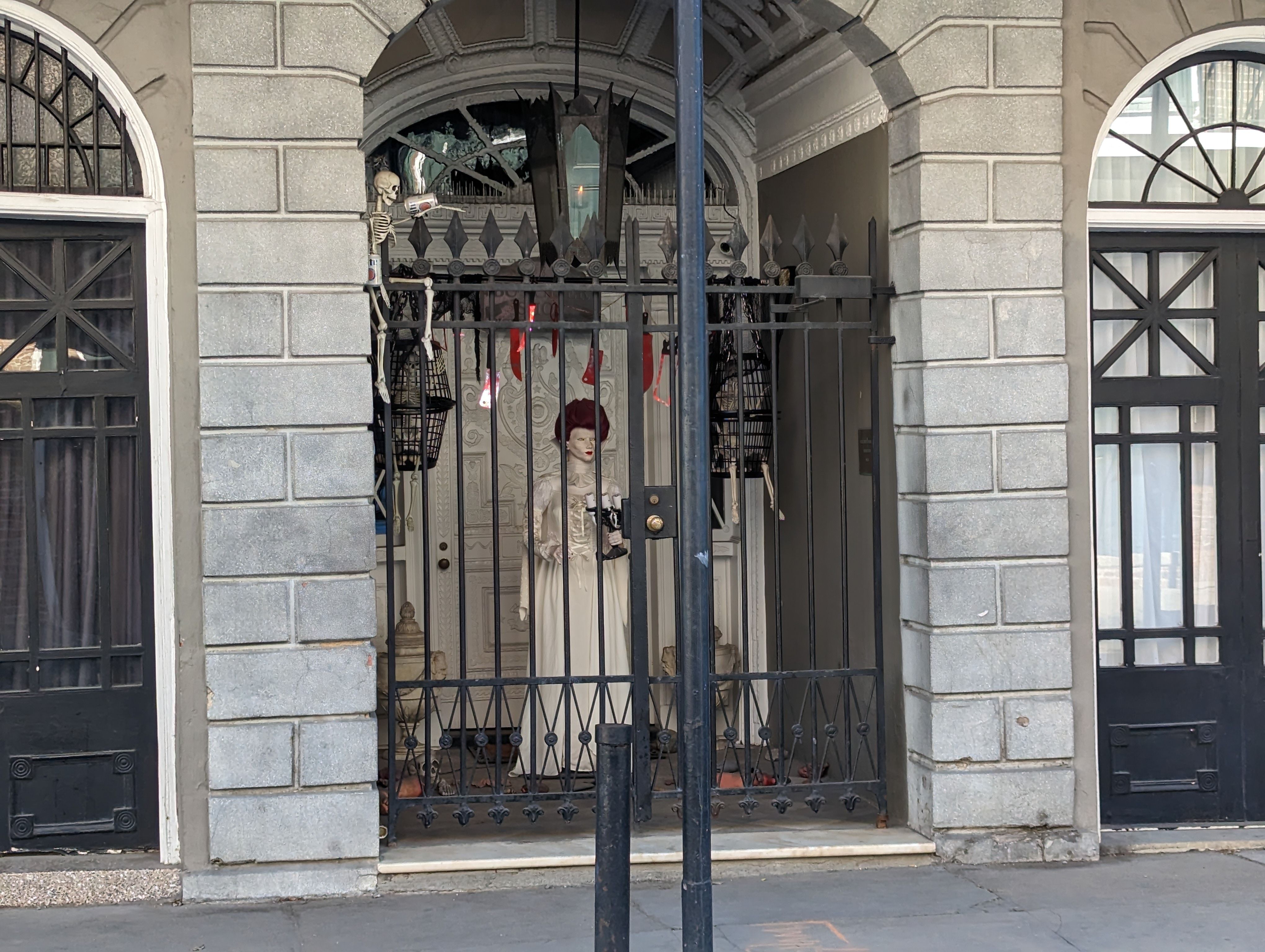 Historic mansion lit in blood-red lighting at night