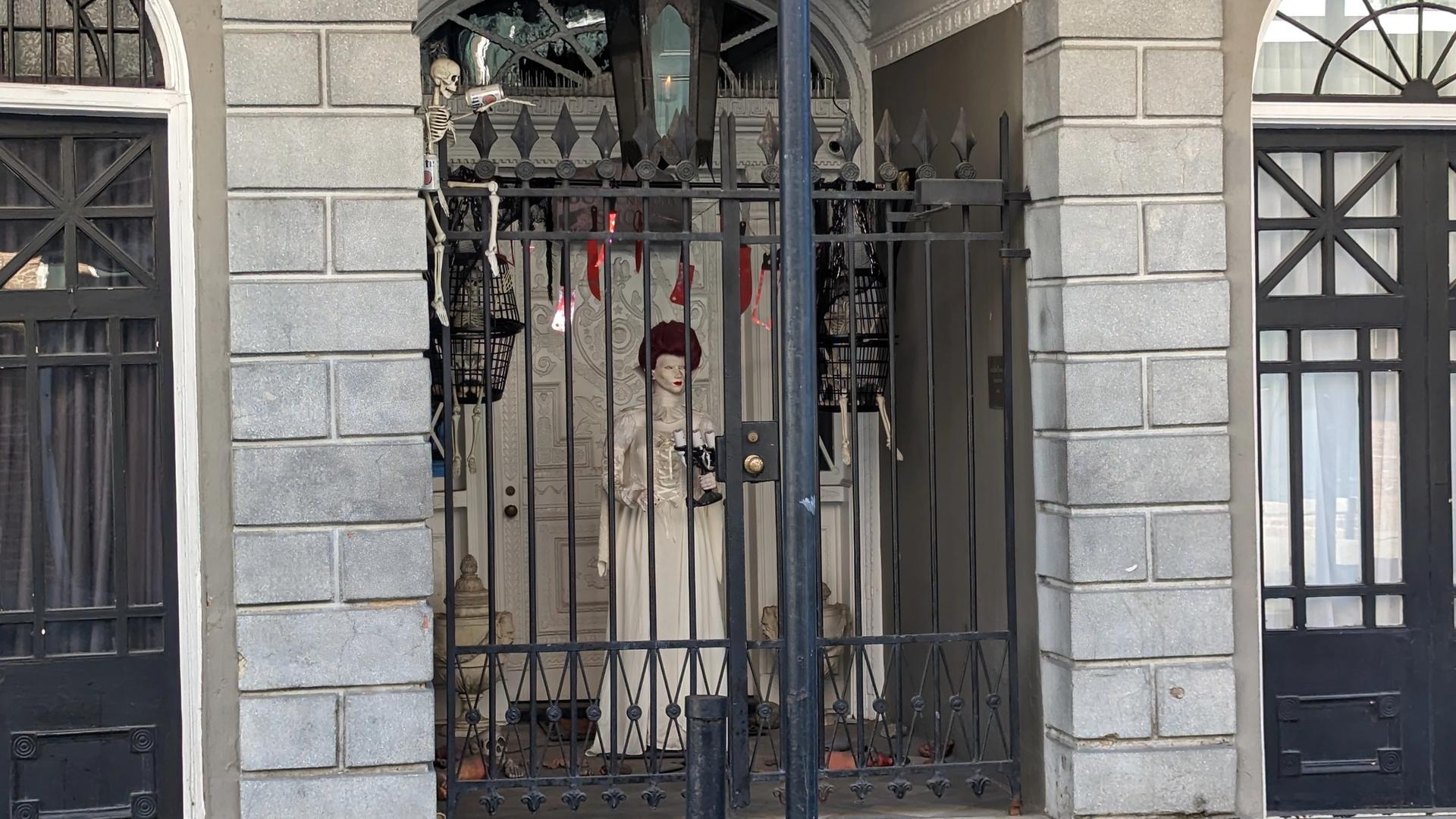 Historic mansion lit in blood-red lighting at night
