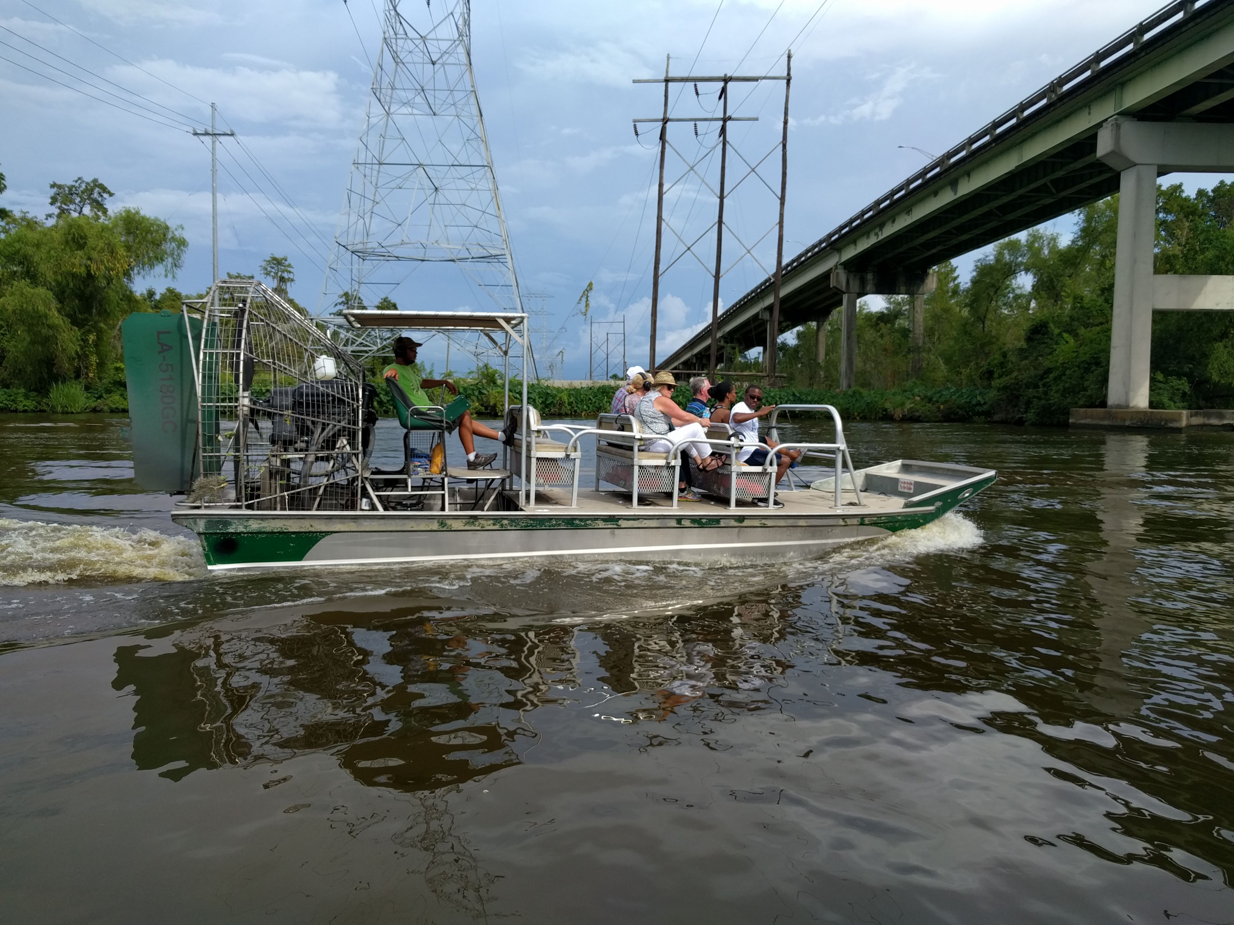 Tourists enjoying small group airboat experience in the bayou