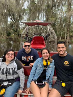 Guests walking beneath the oak-lined alley at Oak Alley Plantation