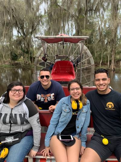 Guests walking beneath the oak-lined alley at Oak Alley Plantation