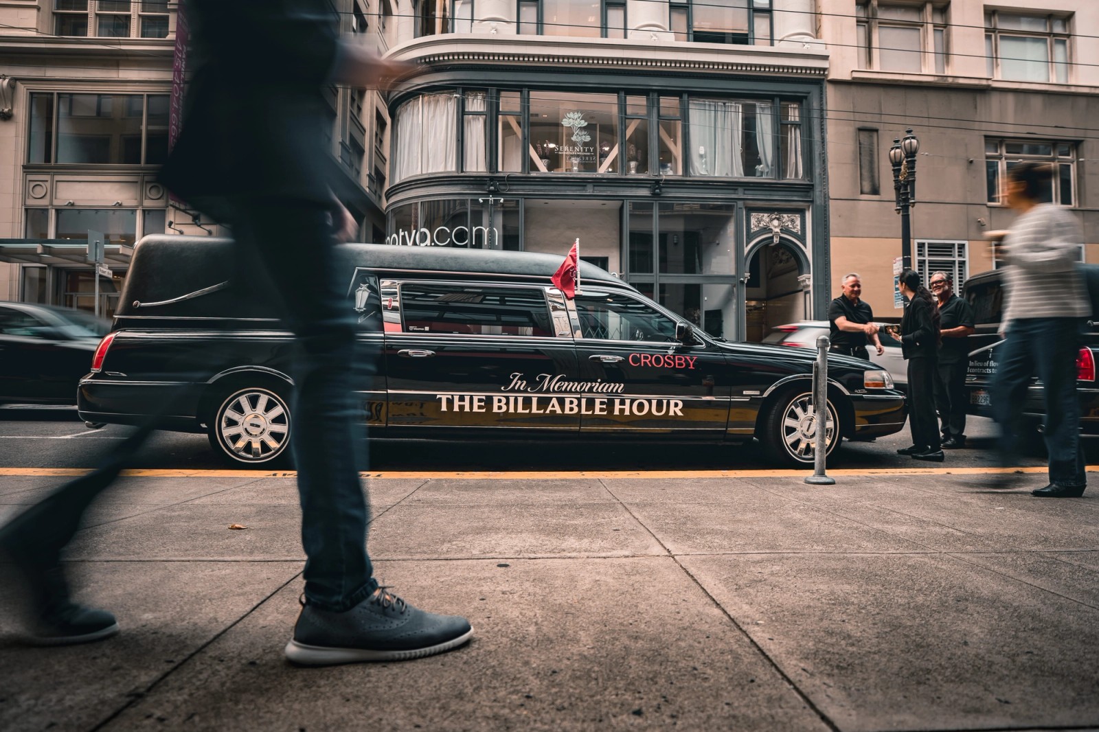 Crosby branded hearse on a city street