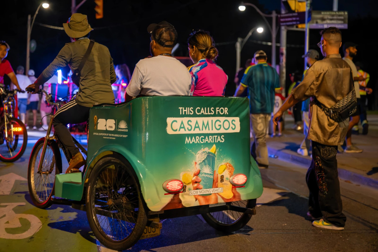 Casamigos branded pedicab carrying matchday fans