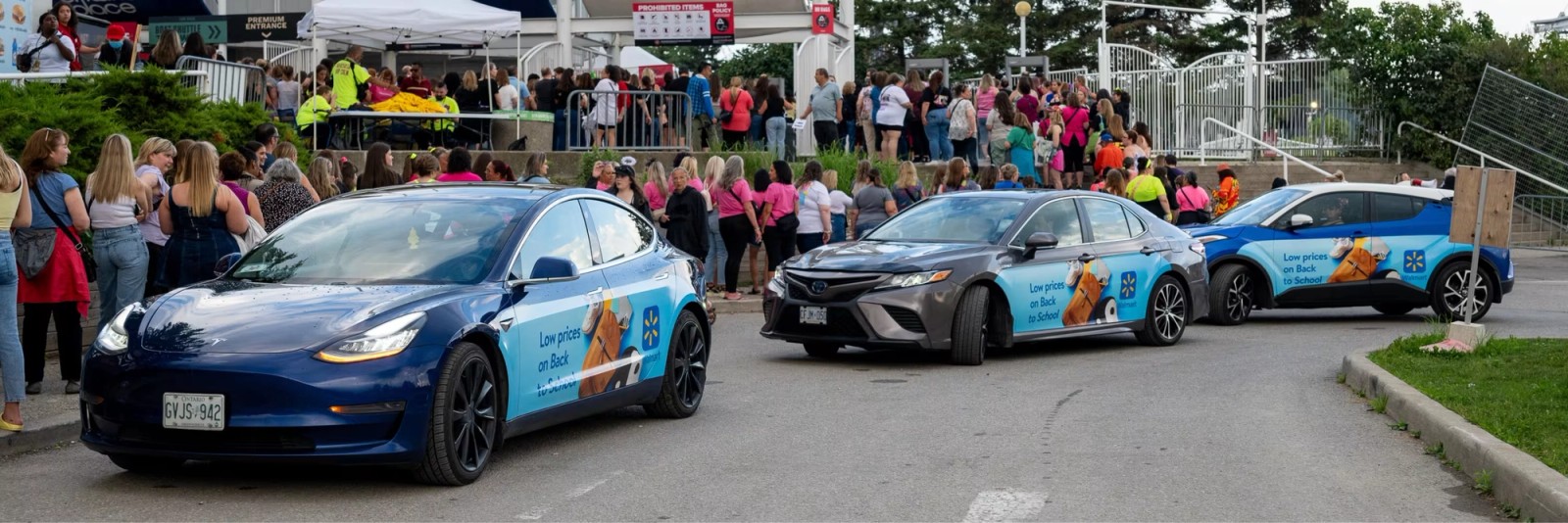 Walmart wrapped vehicles activating around an event