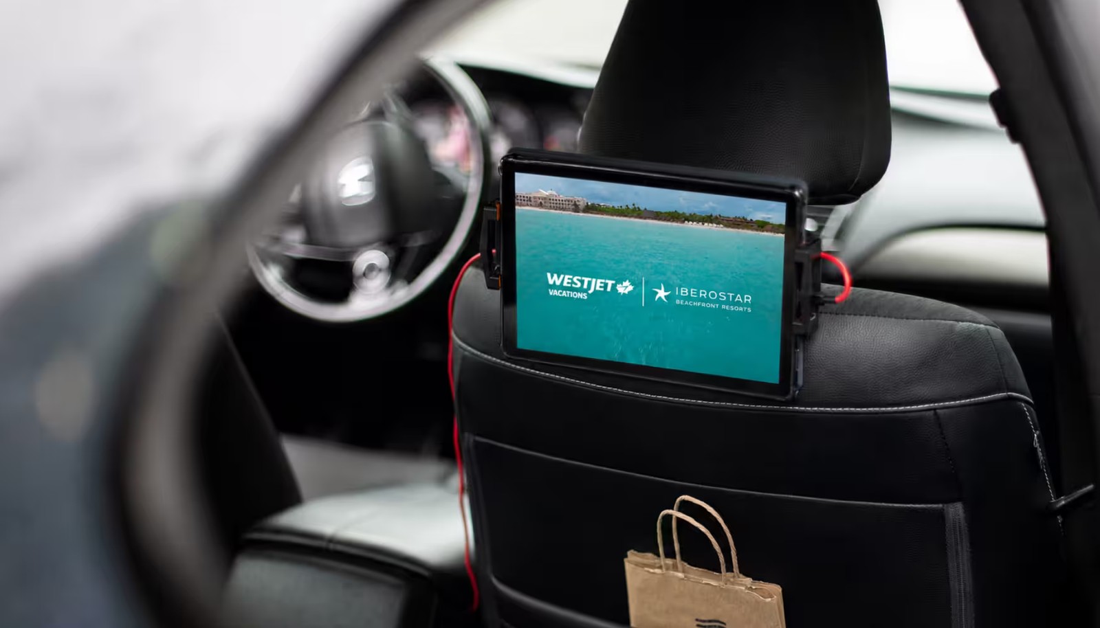 WestJet and Iberostar campaign playing on an in-vehicle tablet