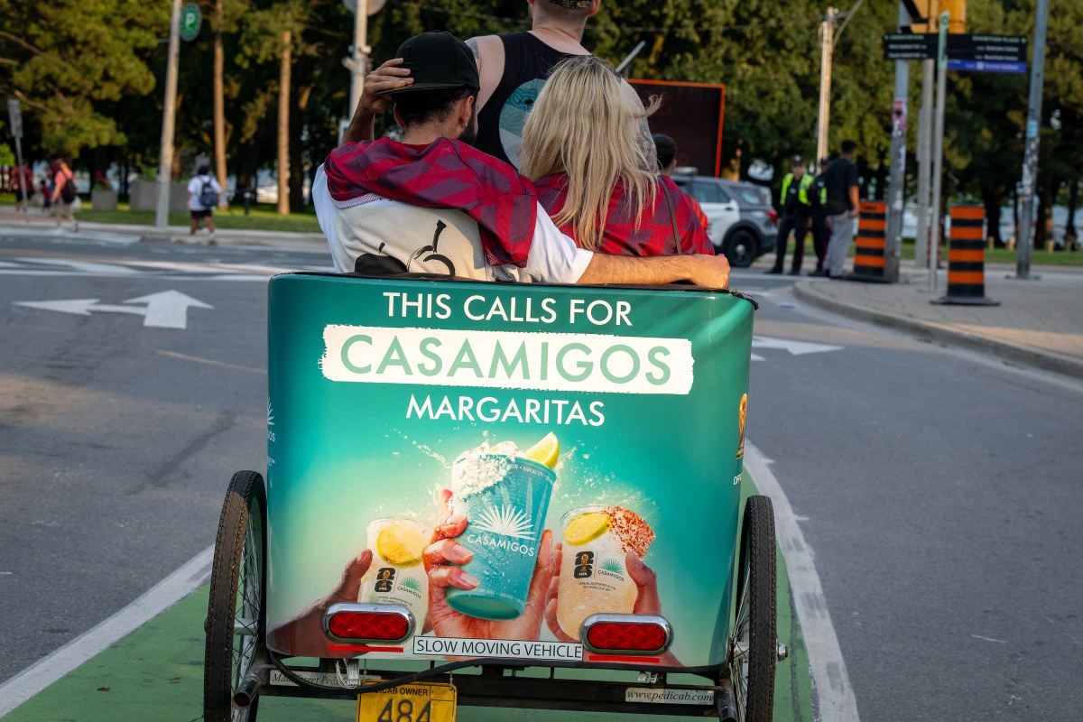 Casamigos branded pedicab carrying matchday fans