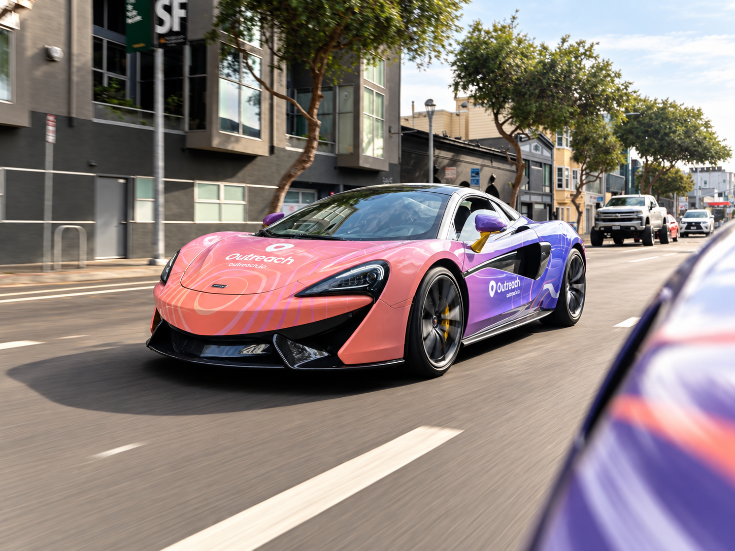 Outreach wrapped McLaren driving through the city