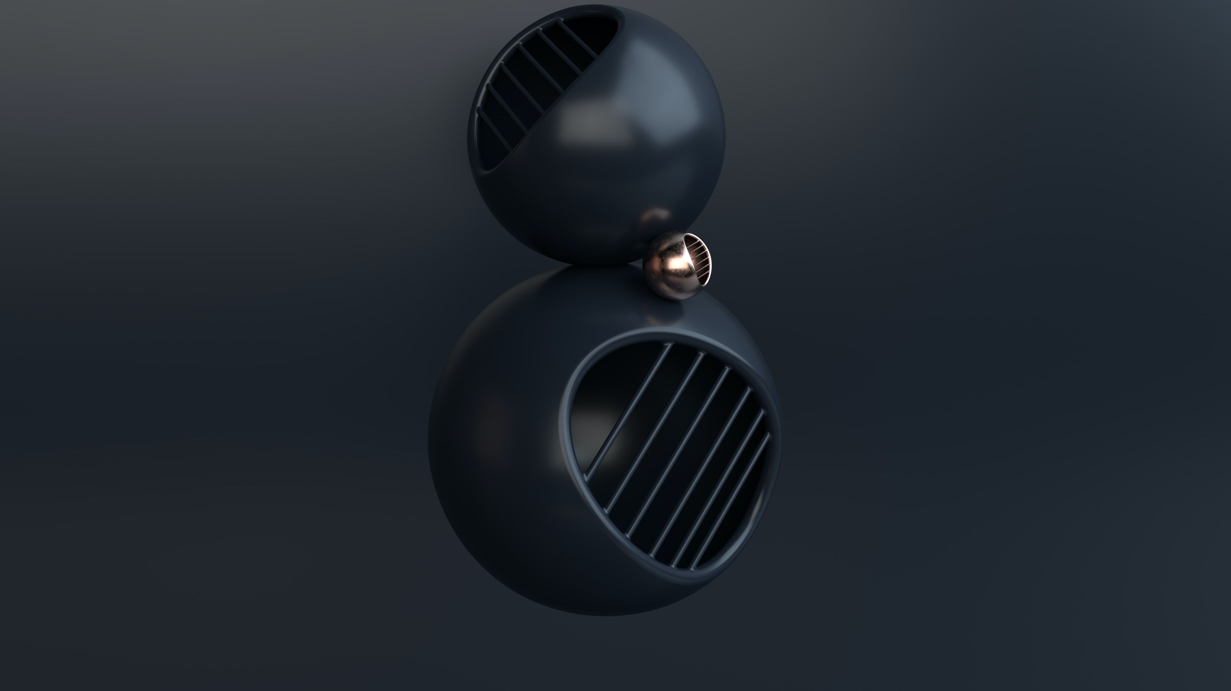 An image of three differently sized 3D balls with the two largest being dark grey and the smallest one being gold