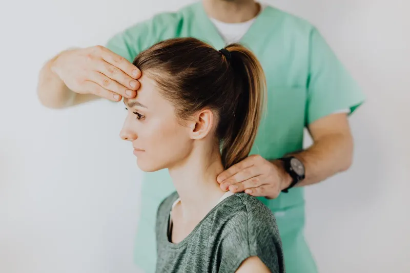 Patient working with a clinician during rehabilitation