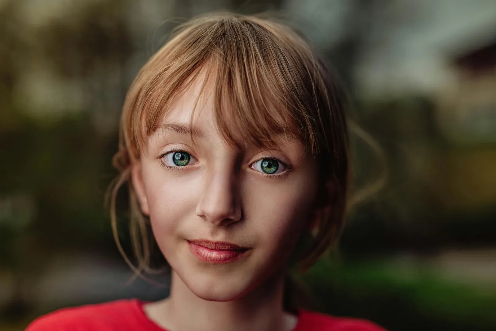 Portrait of a young girl with captivating eyes and natural setting background.