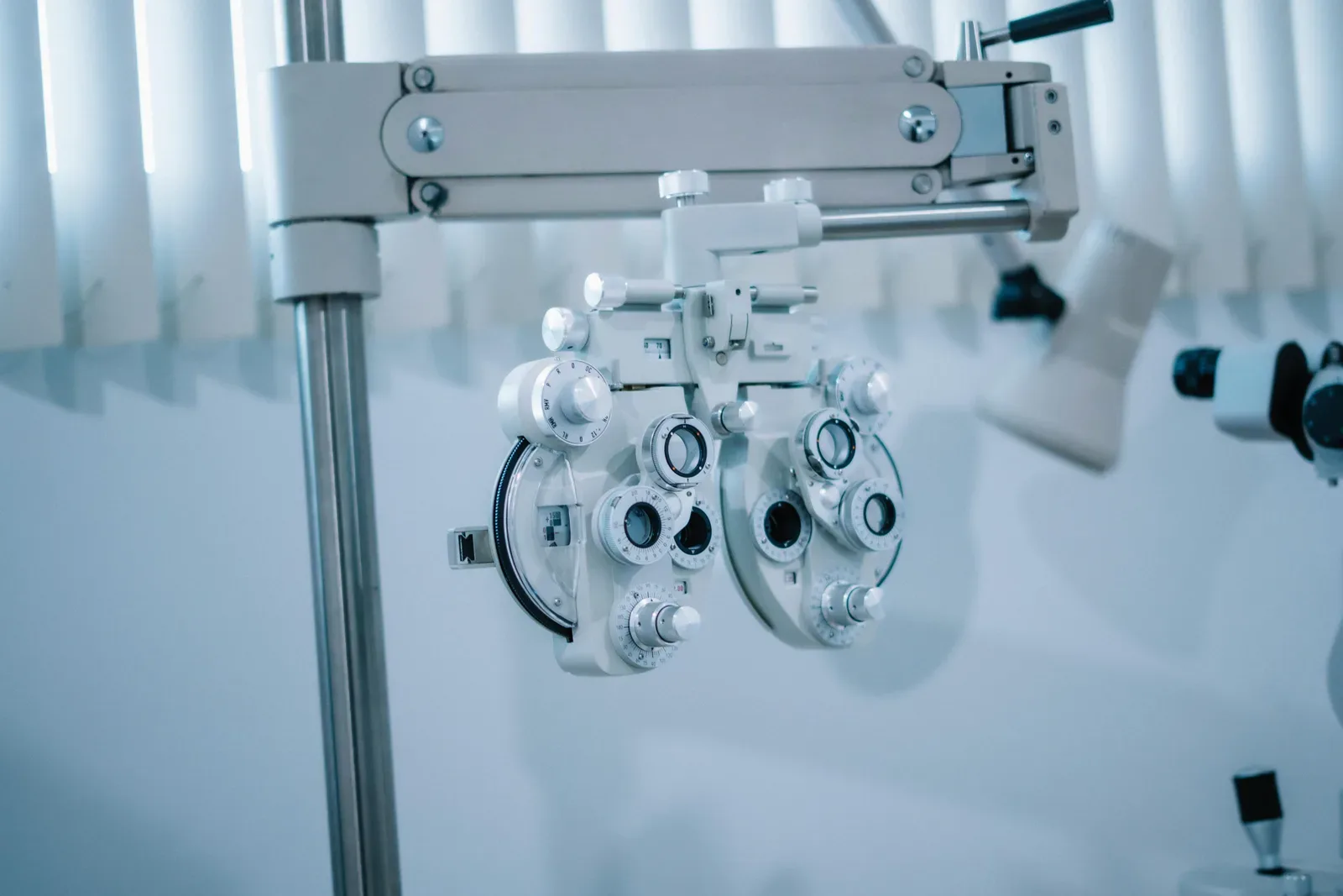 Detailed view of an optical phoropter in a modern eye clinic, used for testing vision clarity.