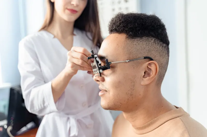 Patient having the front of the eye examined in a clinic