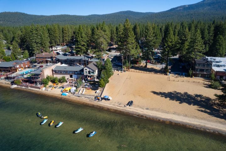 Aerial view of a Lake Tahoe beach with jet skis on the water