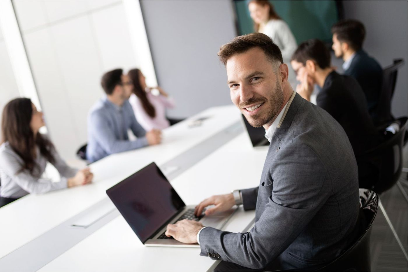 IT professionals working on cybersecurity measures in their laptops