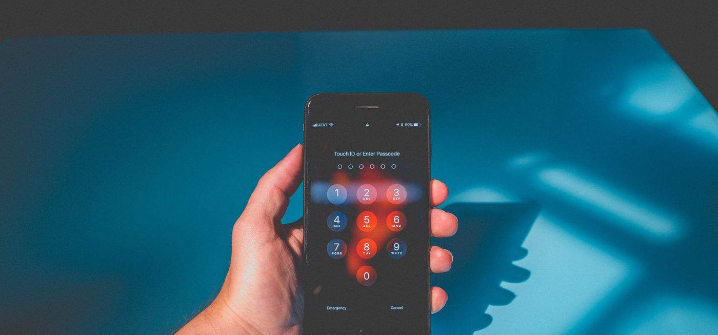 MFA fatigue attack: Woman using a smartphone to authenticate her identity, exemplifying multi-factor authentication