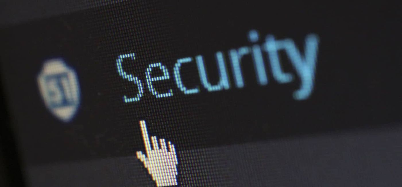 Person closely scrutinizing an MFA prompt on their computer screen, representing steps to detect MFA fatigue attacks