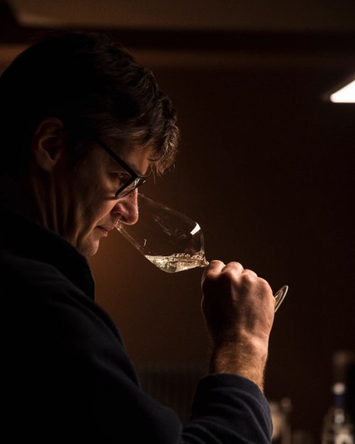 man smelling wine