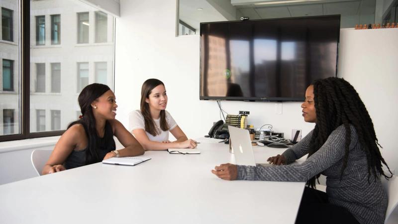 three women sitting at the table