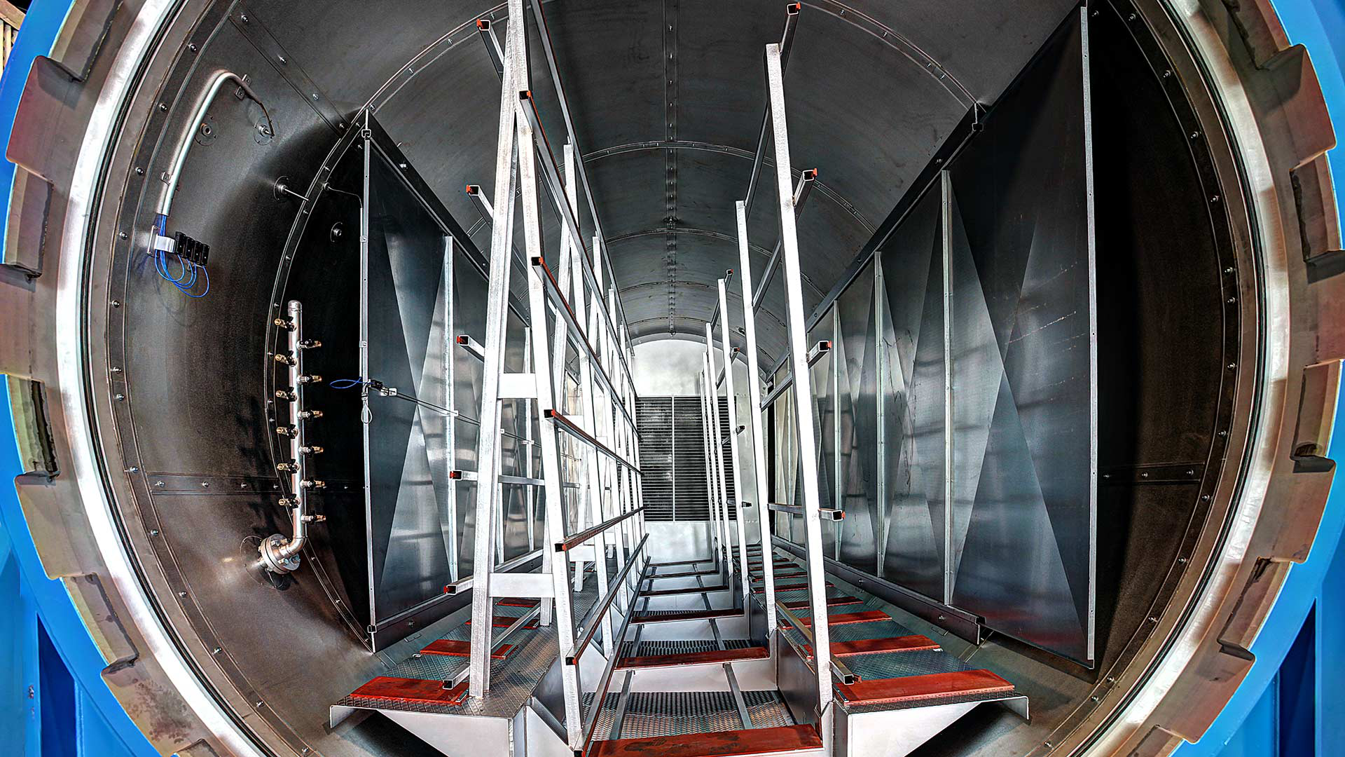 Interior of a Maroso glass autoclave with loading racks