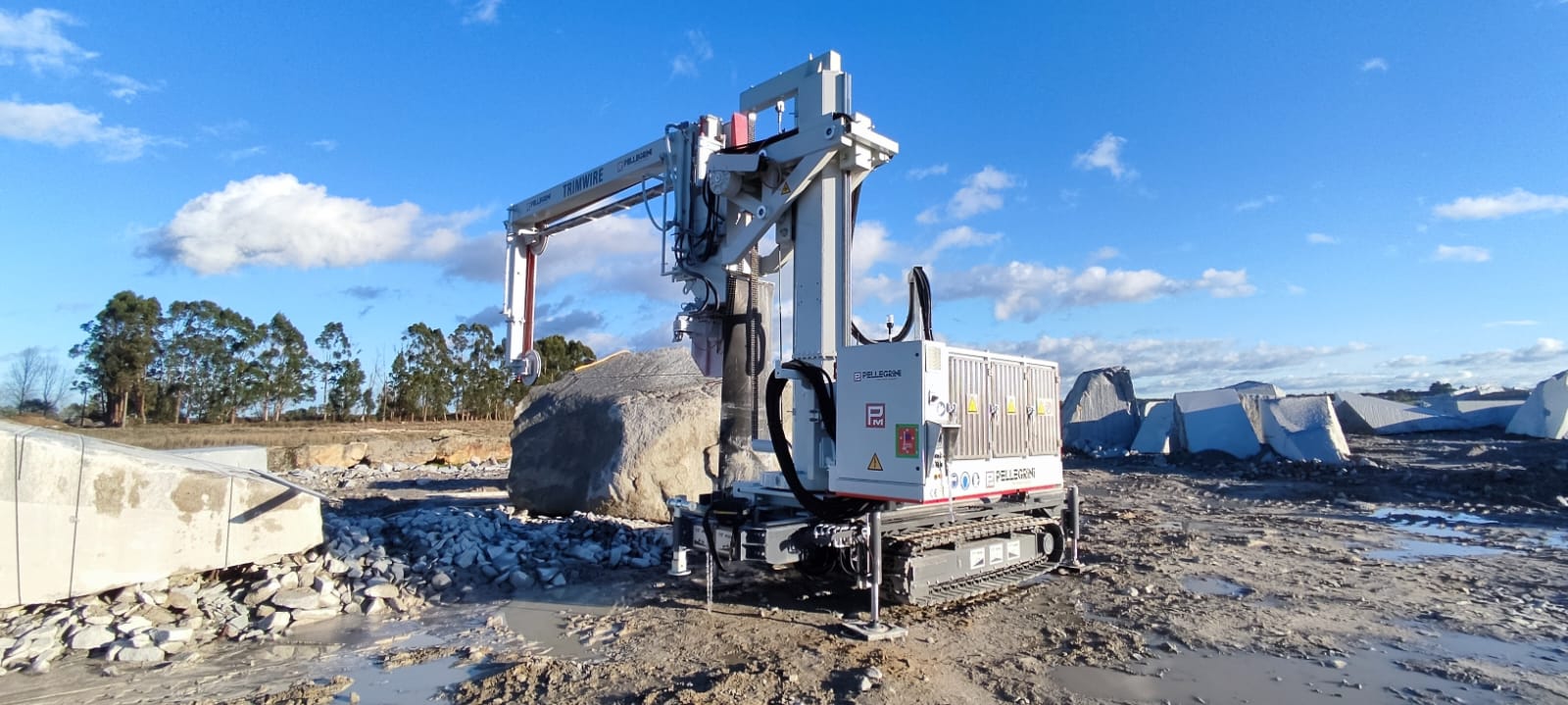 Pellegrini Trimwire mobile tracked diamond wire saw cutting natural stone blocks in a quarry