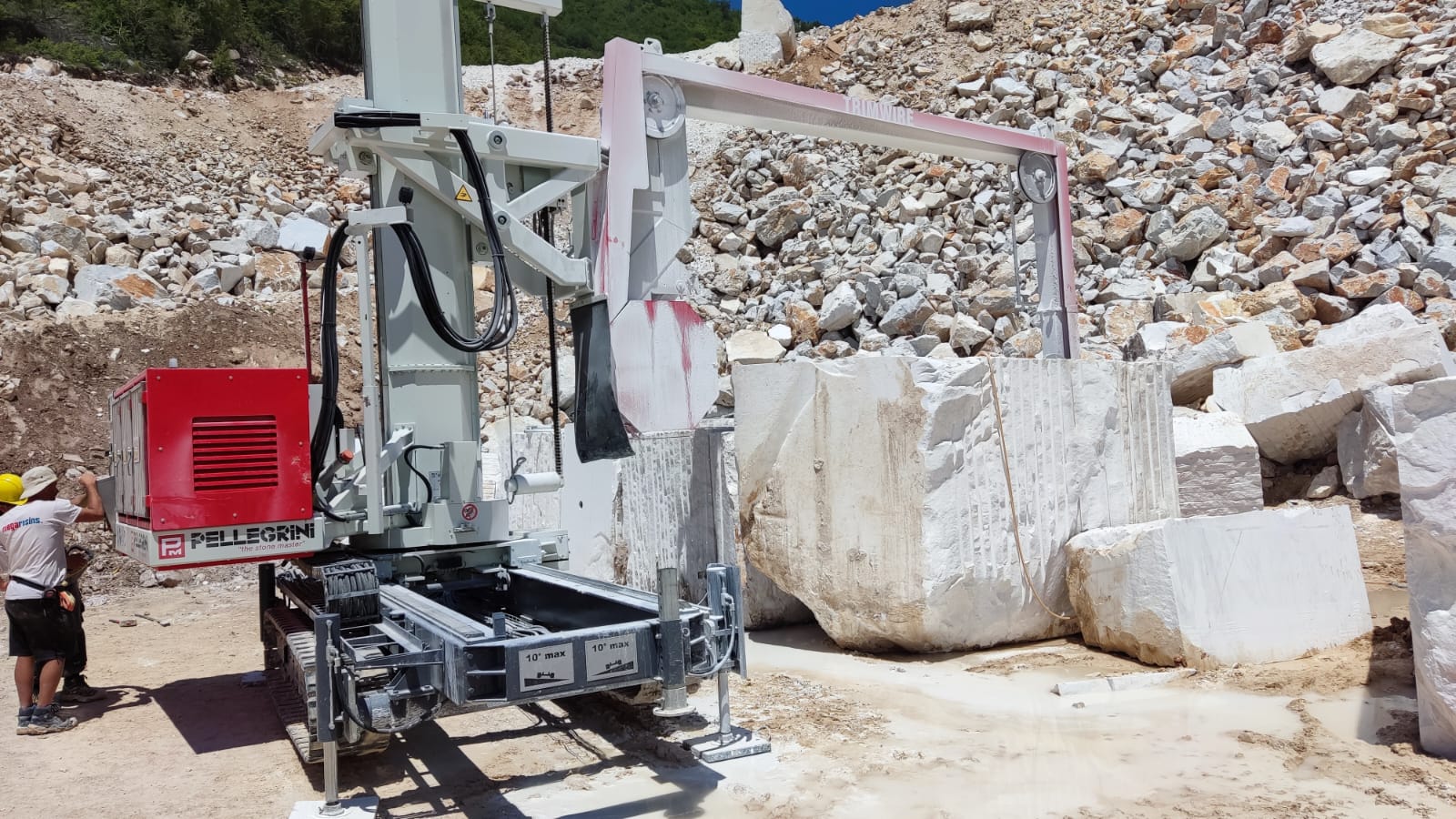 Pellegrini Trimwire mobile tracked diamond wire saw cutting natural stone blocks in a quarry