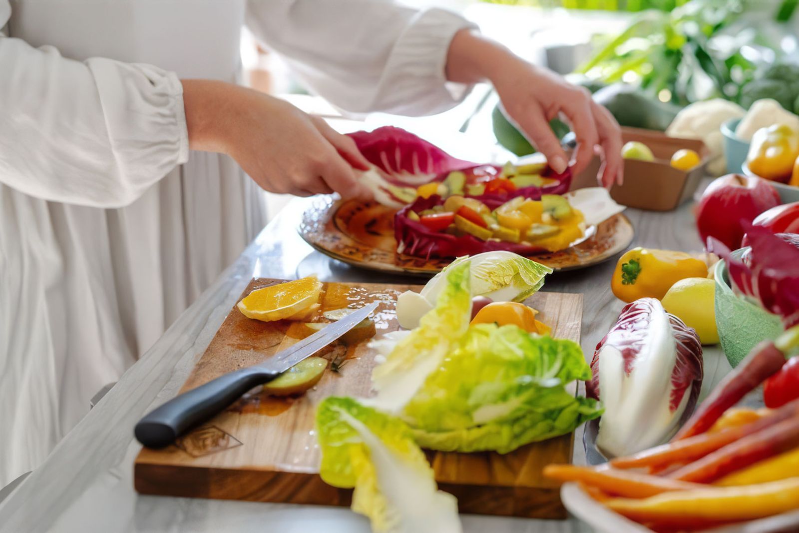 Geraldine preparing a meal as a private chef in a home in Knysna.
