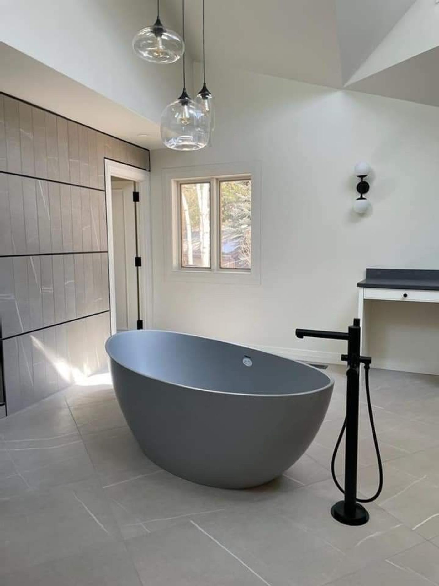 plumber repairing a bathroom sink in Orem