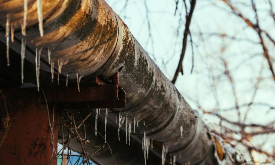 Insulated plumbing pipe during freezing winter weather