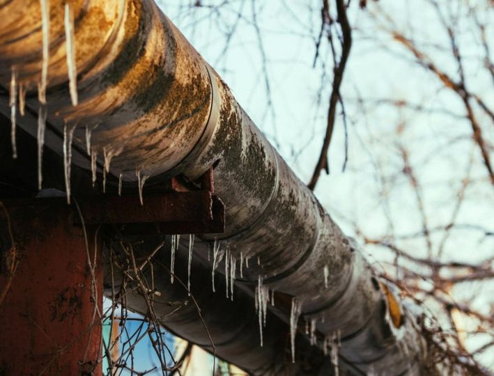 Insulated plumbing pipe during freezing winter weather