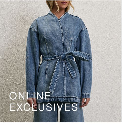 Model wearing a light blue denim wrap top with matching jeans. SHOP ONLINE EXCLUSIVES.