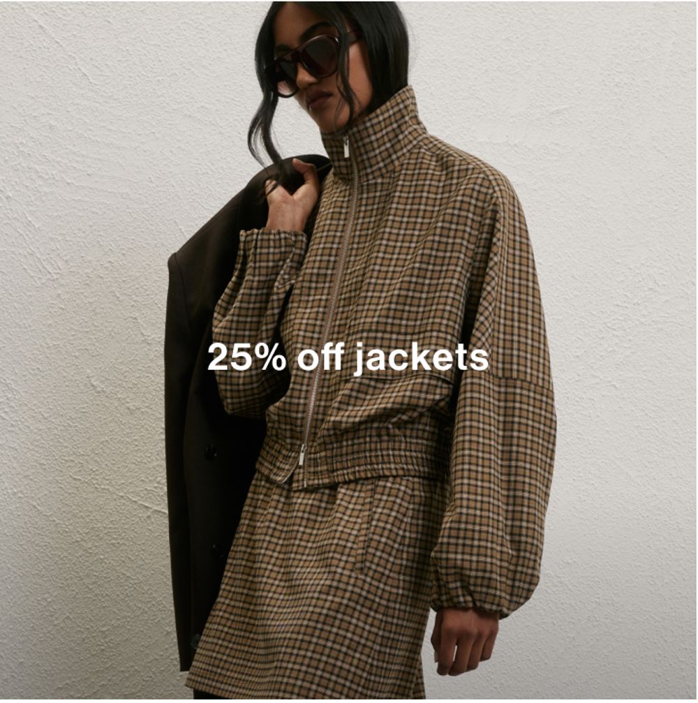 Model wearing a check print jacket and skirt, promoting 25% off jackets